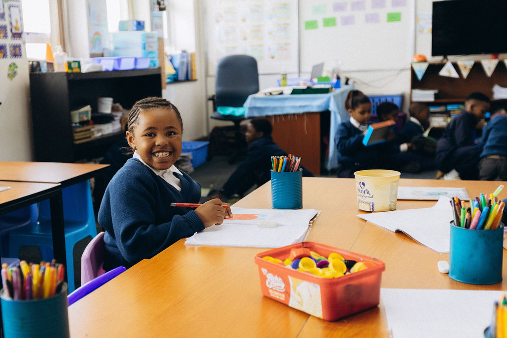 Learner working at a classroom table