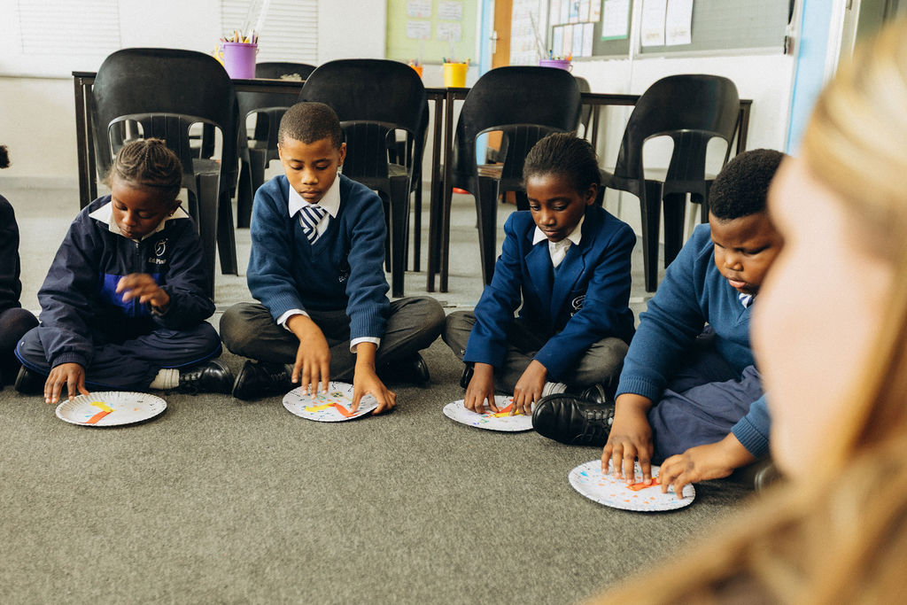 Young learners participating in a practical classroom activity